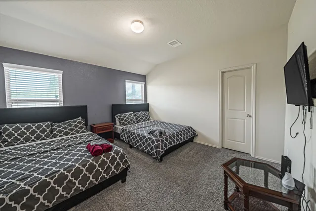 a bathroom with a bathtub and a toilet