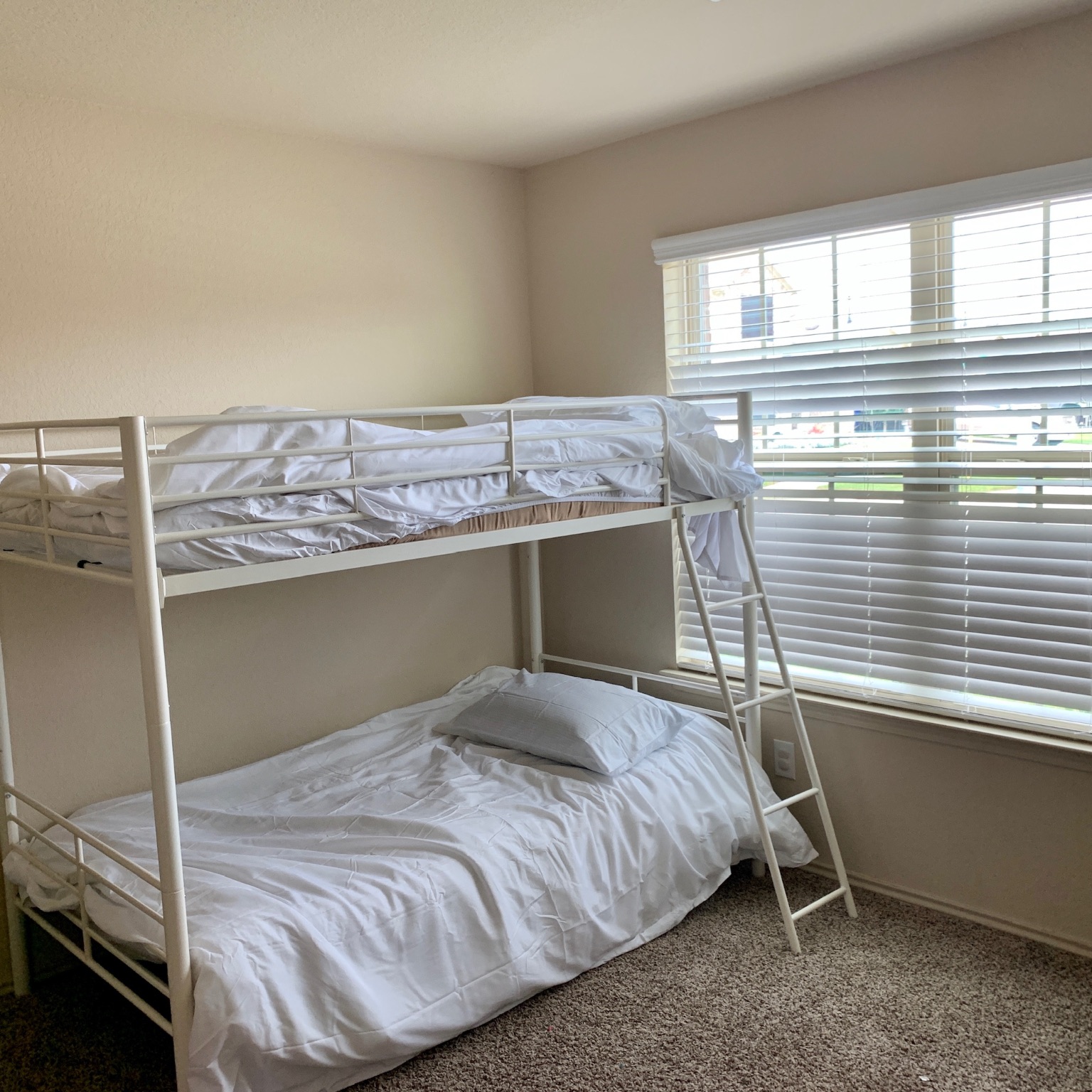 1345 Lariat Rdg Trail Houston, TX 77049 - Photo 10 of 25 a bedroom with a bed and window