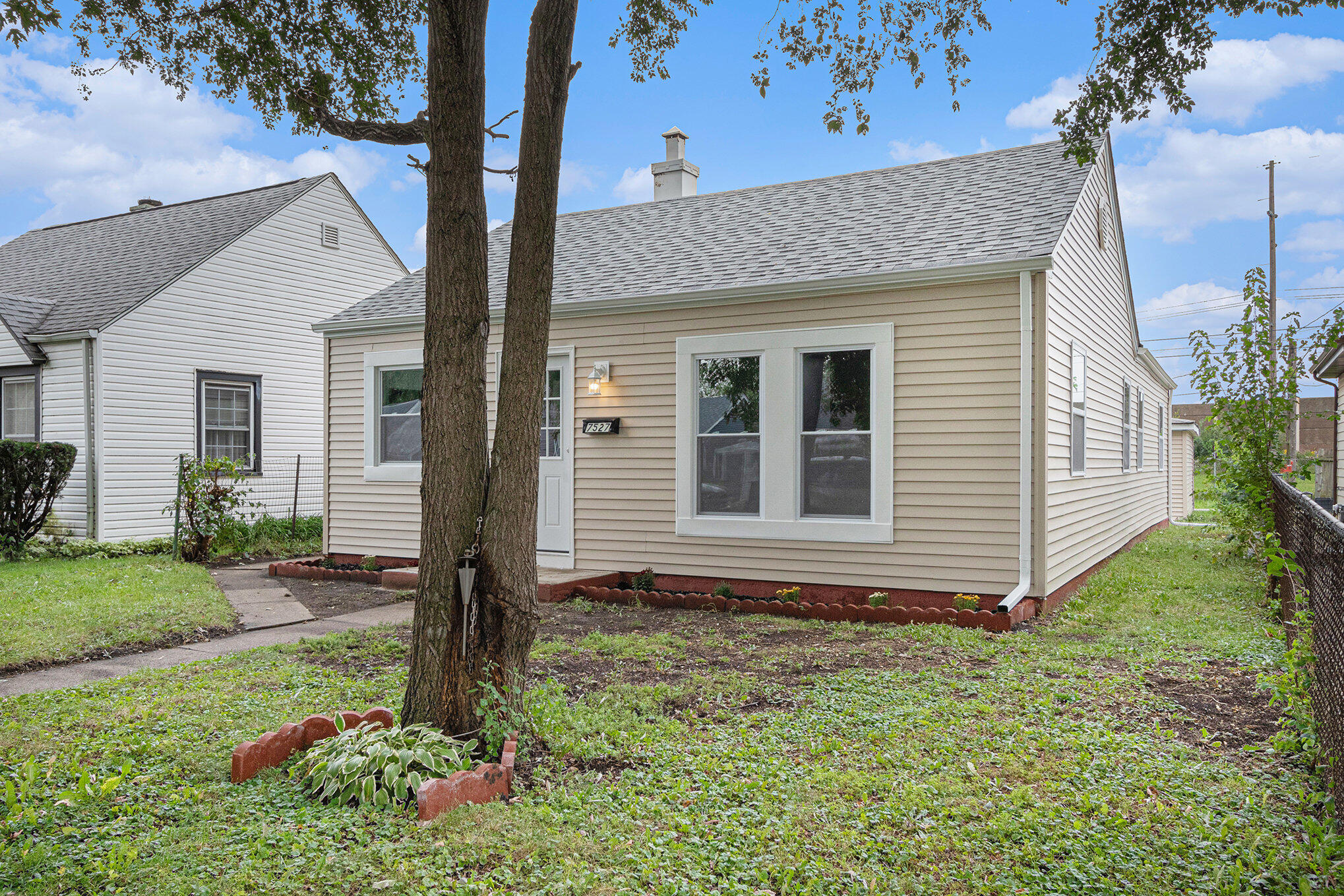 7527 Marshall Avenue Hammond, IN 46323 - Photo 19 of 19 a front view of a house with garden