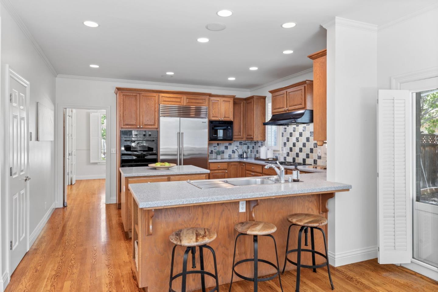120 Gloria Circle Menlo Park, CA 94025 - Photo 18 of 83 a kitchen with stainless steel appliances granite countertop sink stove and refrigerator