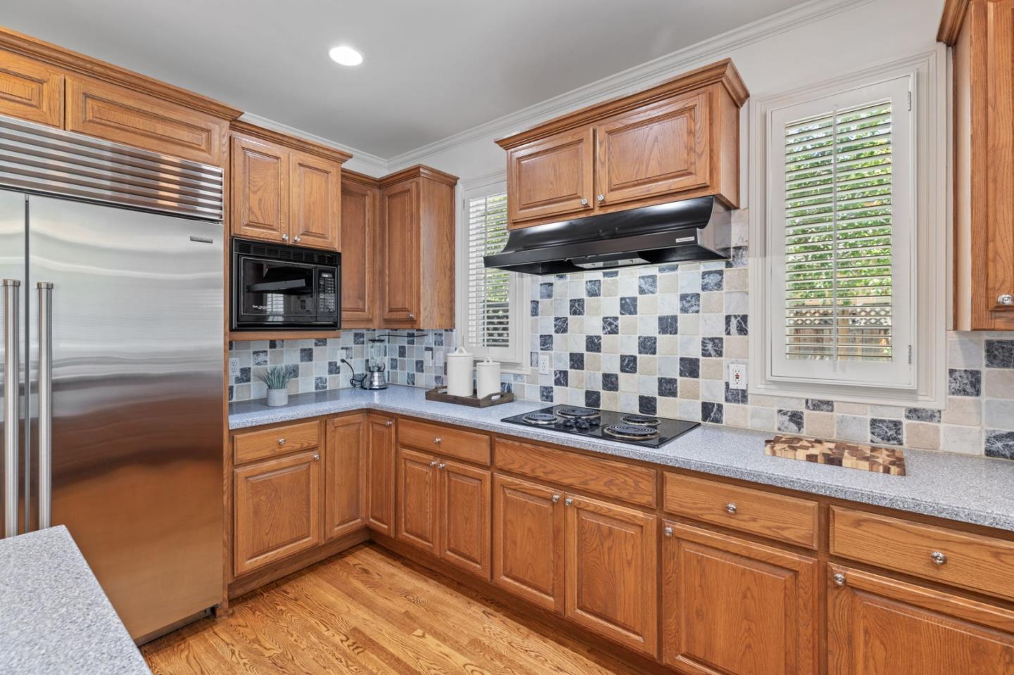 120 Gloria Circle Menlo Park, CA 94025 - Photo 19 of 83 a kitchen with stainless steel appliances a sink stove and cabinets