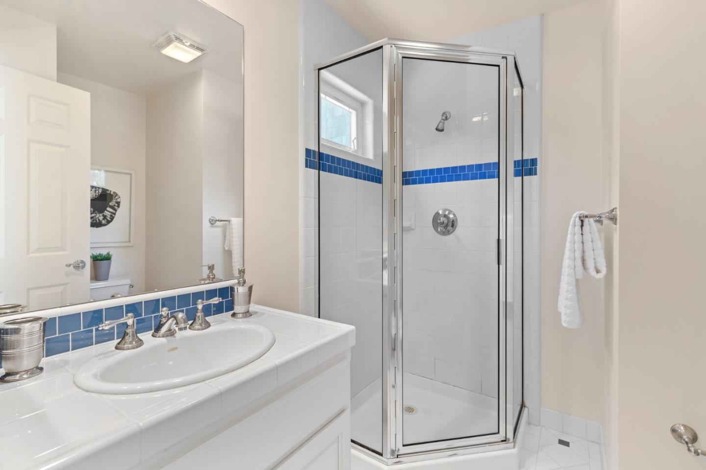 120 Gloria Circle Menlo Park, CA 94025 - Photo 41 of 83 a bathroom with a shower a mirror and a sink