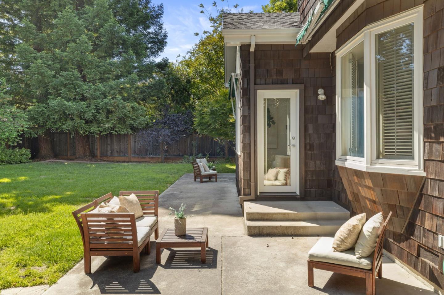 120 Gloria Circle Menlo Park, CA 94025 - Photo 50 of 83 a view of a chair and table in backyard of the house