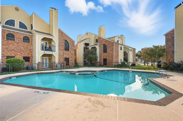 a view of pool with outdoor seating