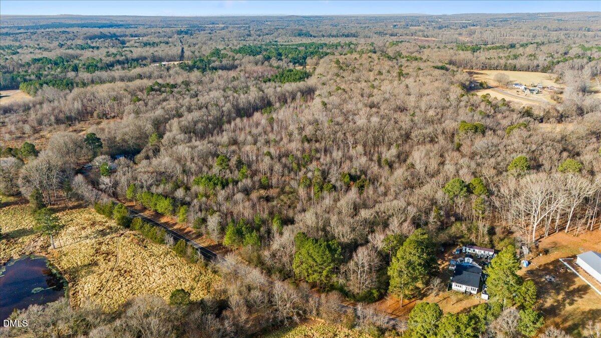 0 Lee Emerson Road Bear Creek, NC 27207 - Photo 6 of 10 an aerial view of house with yard and mountain in the background