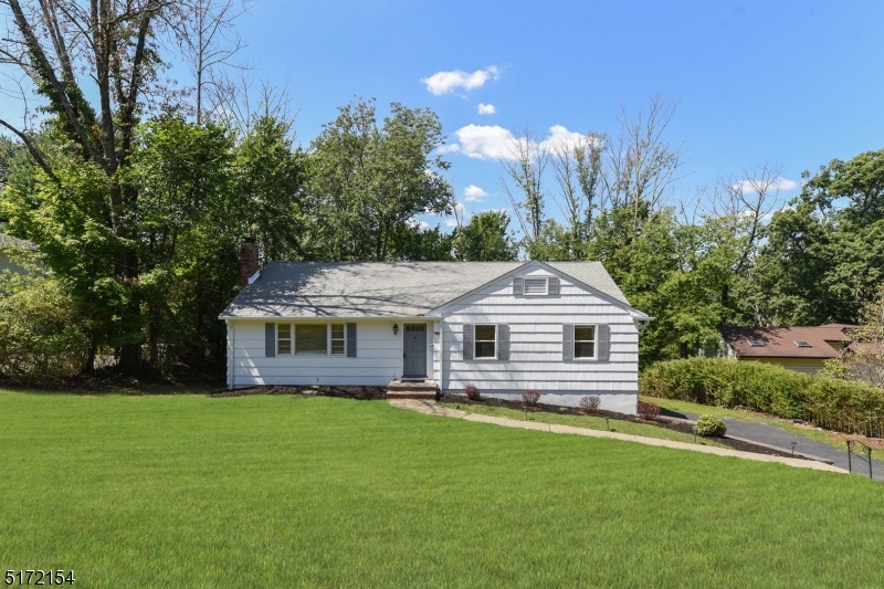 41 Prospect Road Livingston, NJ 07039 - Photo 14 of 14 a front view of house with yard and green space
