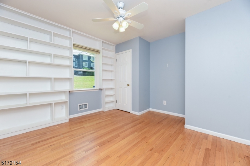 41 Prospect Road Livingston, NJ 07039 - Photo 6 of 14 a view of an empty room with a window and a kitchen
