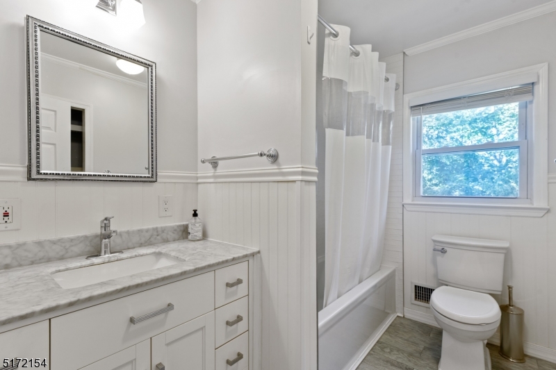 41 Prospect Road Livingston, NJ 07039 - Photo 8 of 14 a bathroom with a granite countertop sink toilet and shower