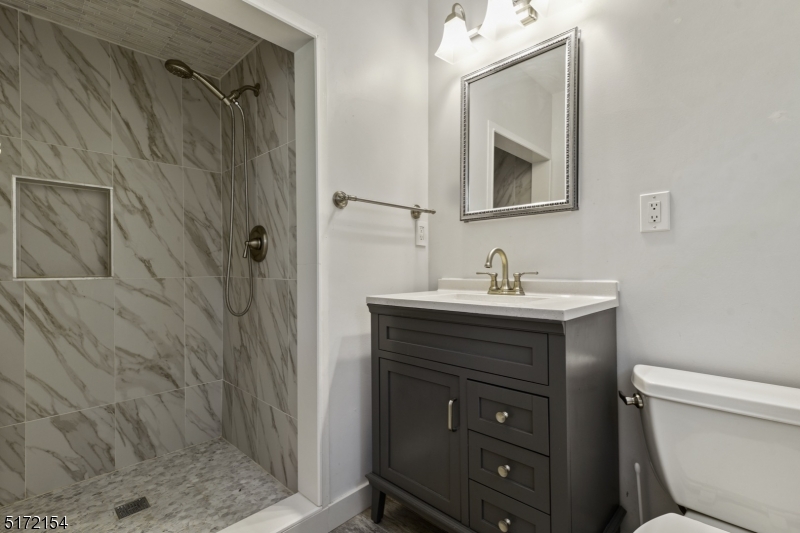 41 Prospect Road Livingston, NJ 07039 - Photo 9 of 14 a bathroom with a sink a toilet and shower
