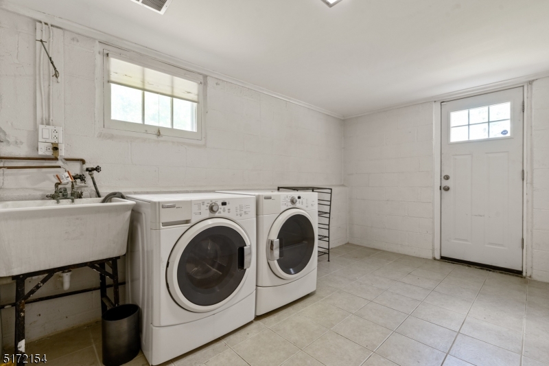 41 Prospect Road Livingston, NJ 07039 - Photo 10 of 14 a utility room with dryer and washer