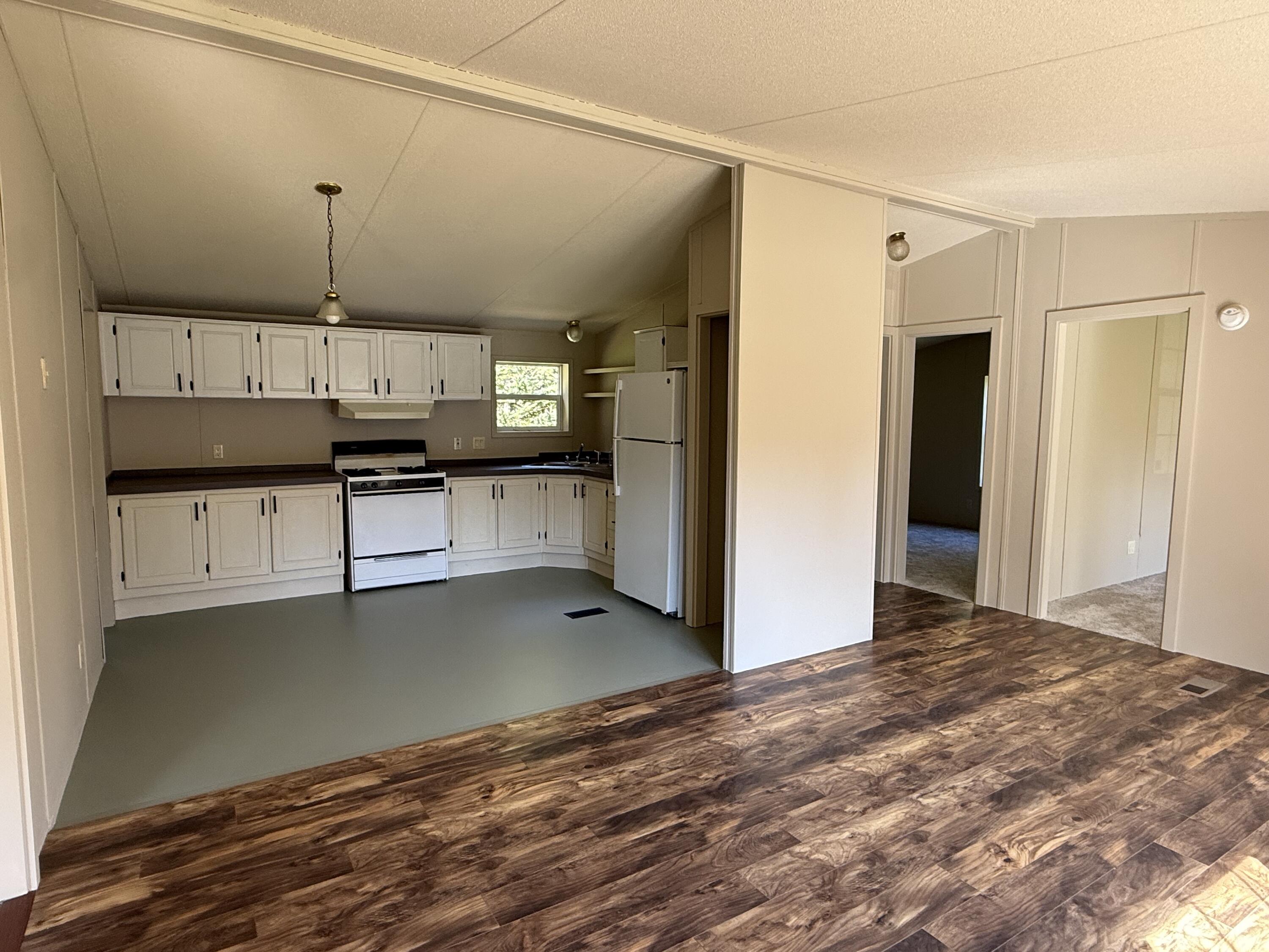 370 Oceanville Road Stonington, ME 04681 - Photo 3 of 12 living room to kitchen left side