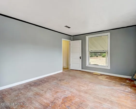 a view of a room with a window and storage
