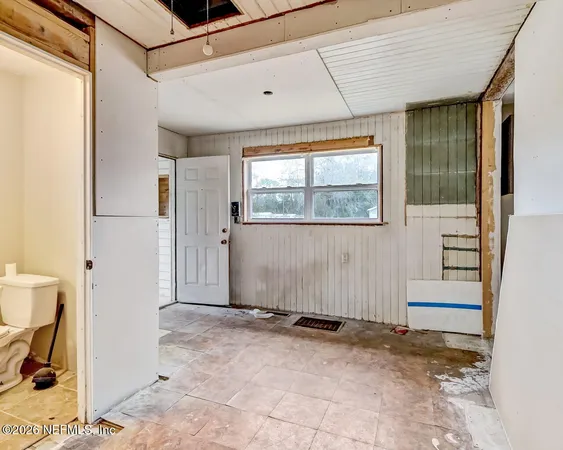 a view of a kitchen from the hallway