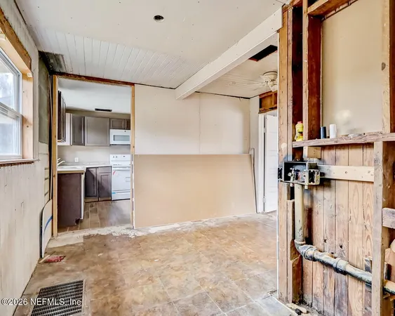 a bathroom with a sink a mirror and a shower