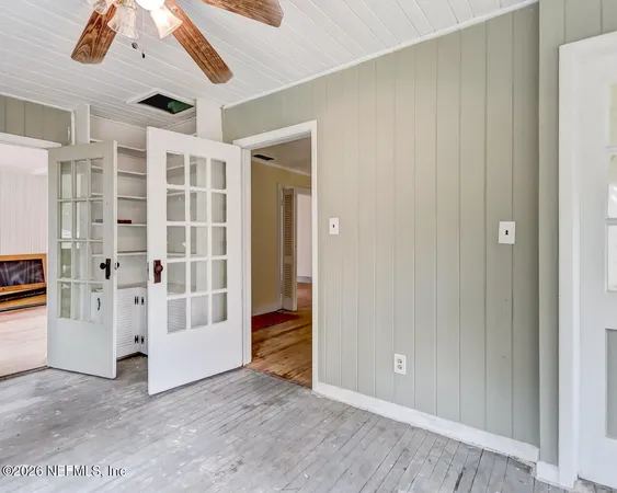 a view of a livingroom with a hardwood floor and a ceiling fan