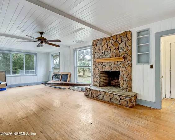a view of a livingroom with table and chair
