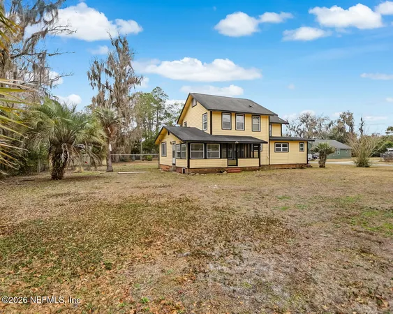 a house with trees in the background