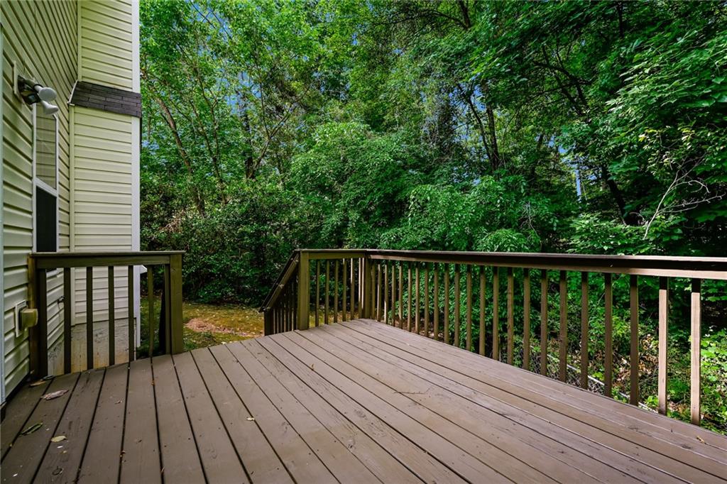 4468 Abram Way Conley, GA 30288 - Photo 17 of 23 a view of balcony with wooden floor and fence