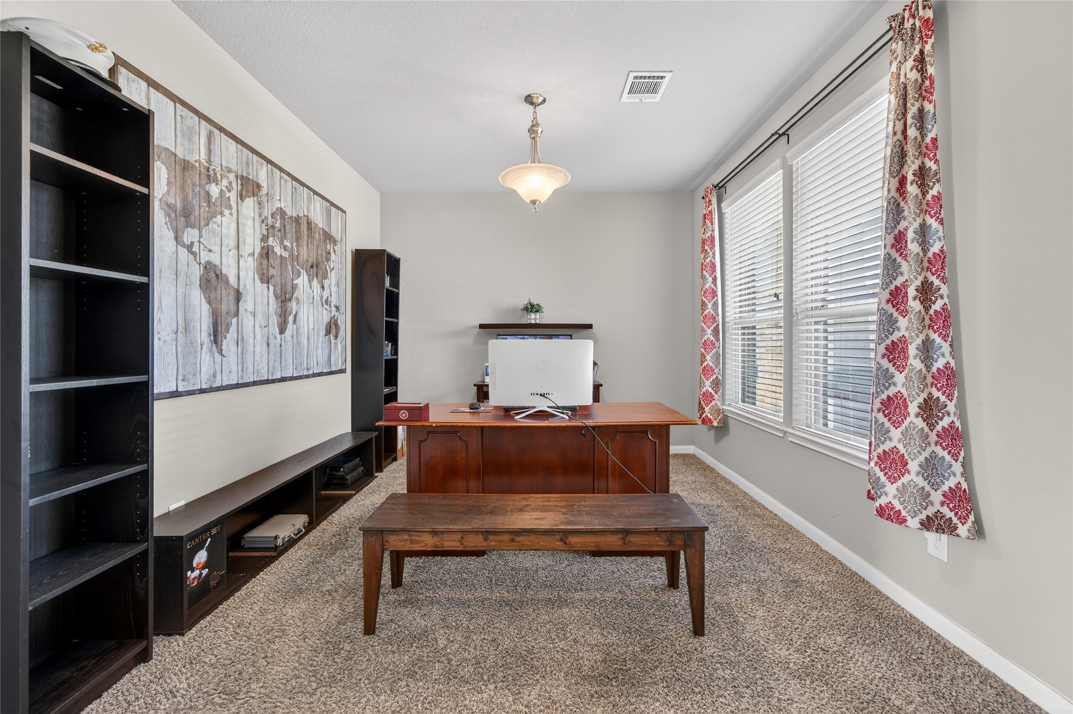 361 Lake Line Drive Alvin, TX 77511 - Photo 14 of 36 The study is a quiet retreat located off the main entry, featuring plush carpeting, large windows, and ample space for a professional workstation or library.