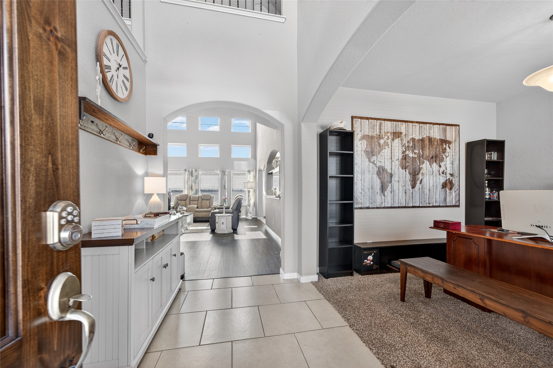 361 Lake Line Drive Alvin, TX 77511 - Photo 3 of 36 Step through the grand foyer, where tall ceilings and an open archway lead you directly into the heart of the home's airy living spaces