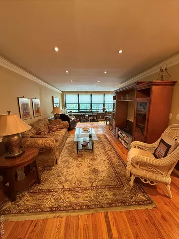 a living room with furniture fireplace and a flat screen tv
