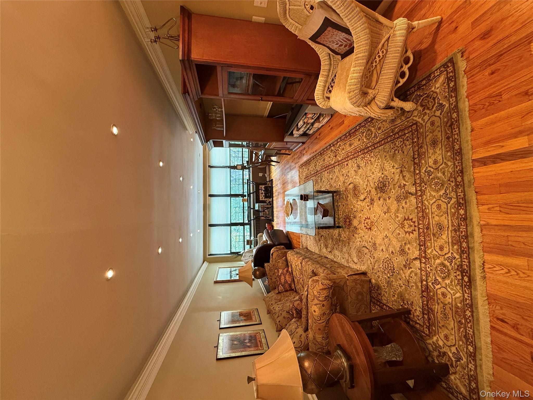 a living room with furniture fireplace and a flat screen tv