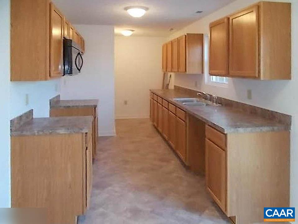 2991 Cedar Lane Road Kents Store, VA 23084 - Photo 5 of 21 a kitchen with stainless steel appliances granite countertop a refrigerator and a stove top oven
