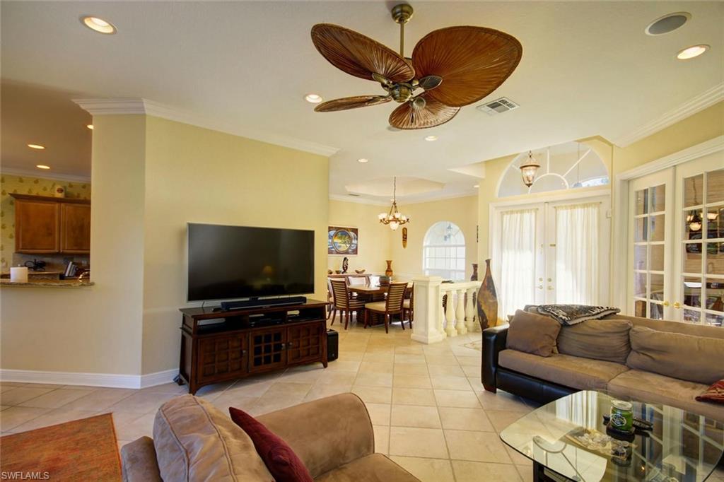 24978 Paradise Road Bonita Springs, FL 34135 - Photo 4 of 25 a living room with furniture and a flat screen tv