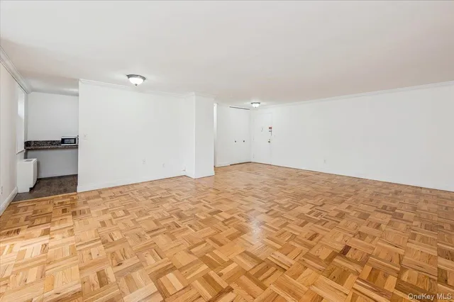 a view of a bedroom with a bed and a rug