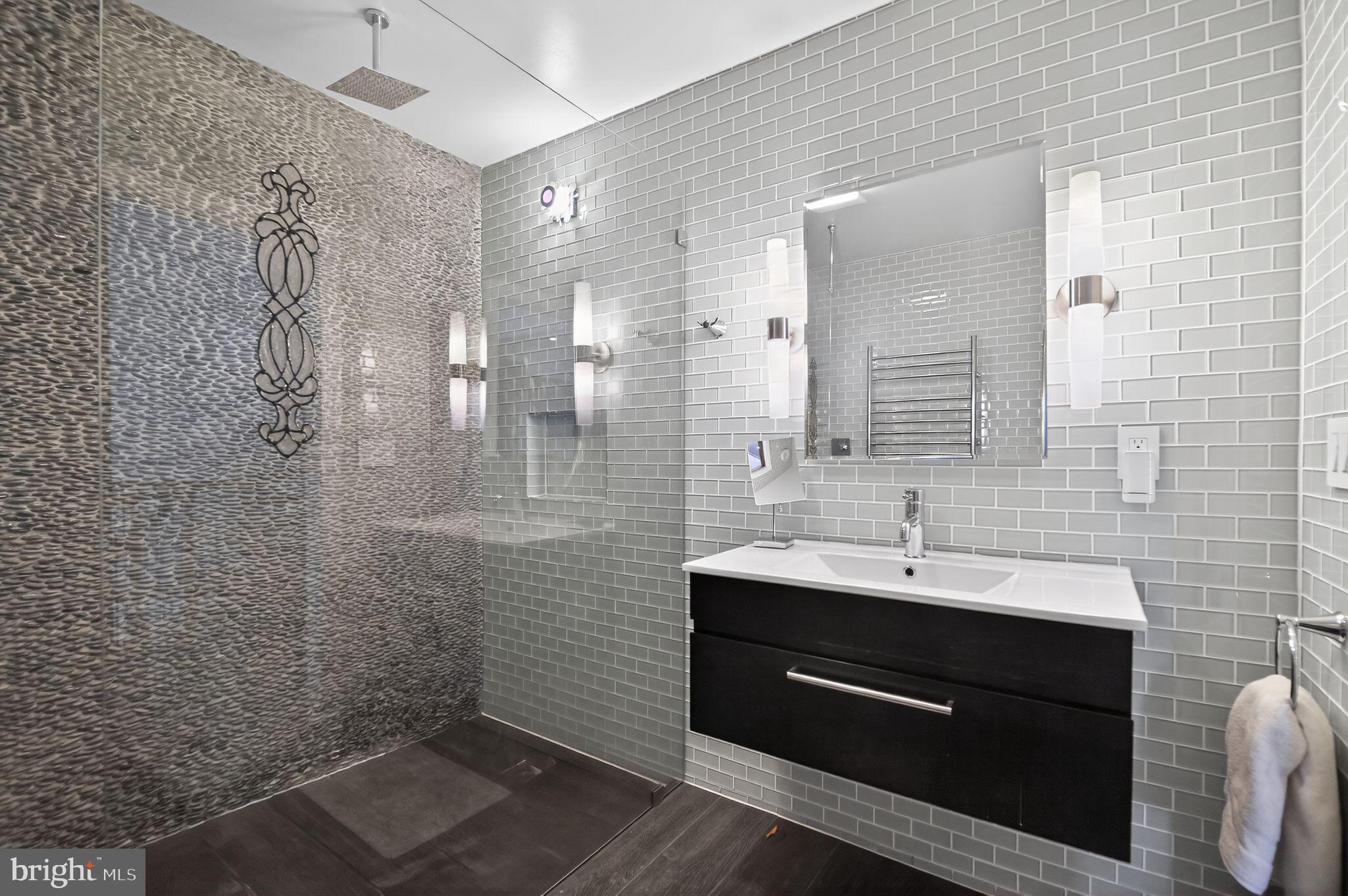 128 Rees Place Falls Church, VA 22046 - Photo 35 of 47 a bathroom with a sink and a mirror