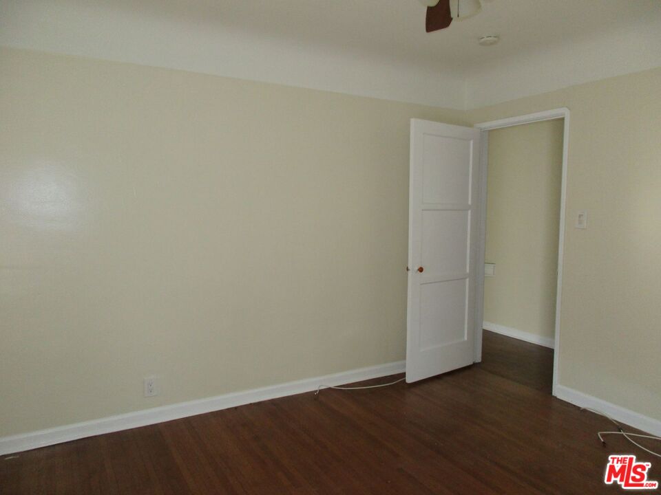 5108 Valley Ridge Avenue View Park, CA 90043 - Photo 24 of 33 a view of an empty room with wooden floor