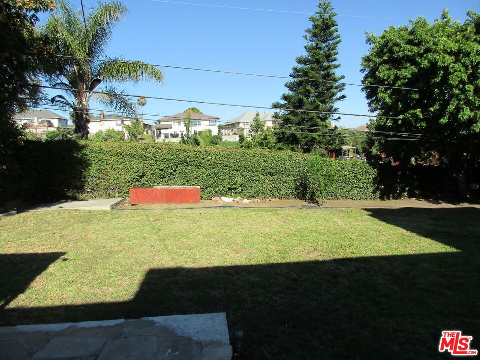 5108 Valley Ridge Avenue View Park, CA 90043 - Photo 32 of 33 a view of an outdoor space and a yard