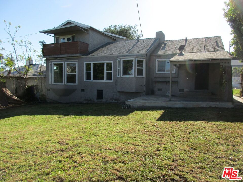 5108 Valley Ridge Avenue View Park, CA 90043 - Photo 33 of 33 a front view of a house with swimming pool