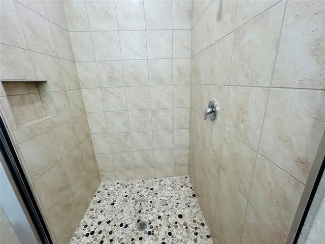 a bathroom with a shower and a toilet