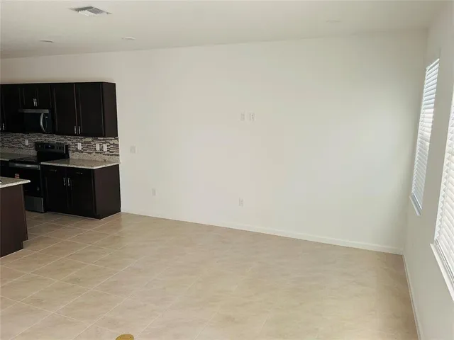 a view of kitchen with cabinets