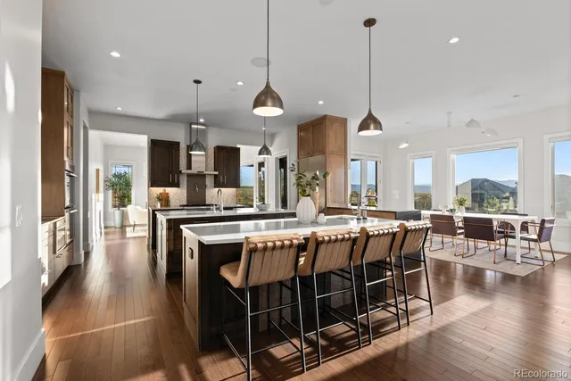 a large kitchen with lots of counter space and stainless steel appliances
