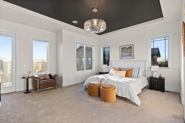 a large kitchen with kitchen island a large counter space a sink a window and stainless steel appliances