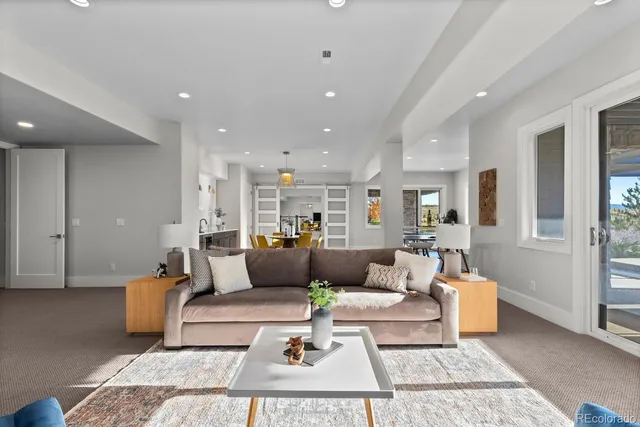 a view of kitchen with stainless steel appliances granite countertop living room and living room
