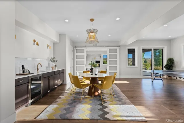 a living room with furniture window and wooden floor