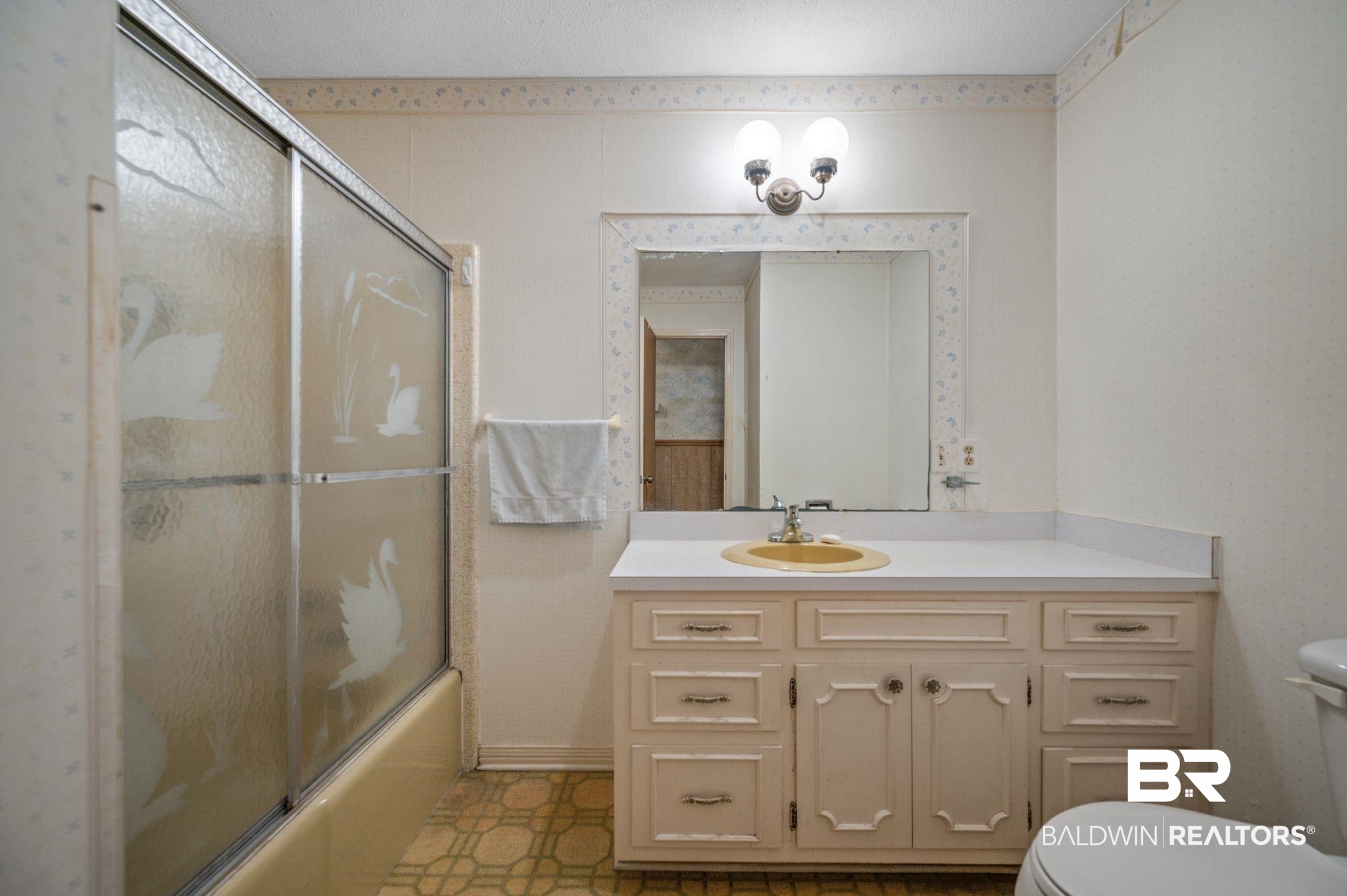 15880 Pine Grove Rd Extension West Bay Minette, AL 36507 - Photo 28 of 44 Full bathroom with tile patterned floors, vanity, shower / bath combination with glass door, and toilet