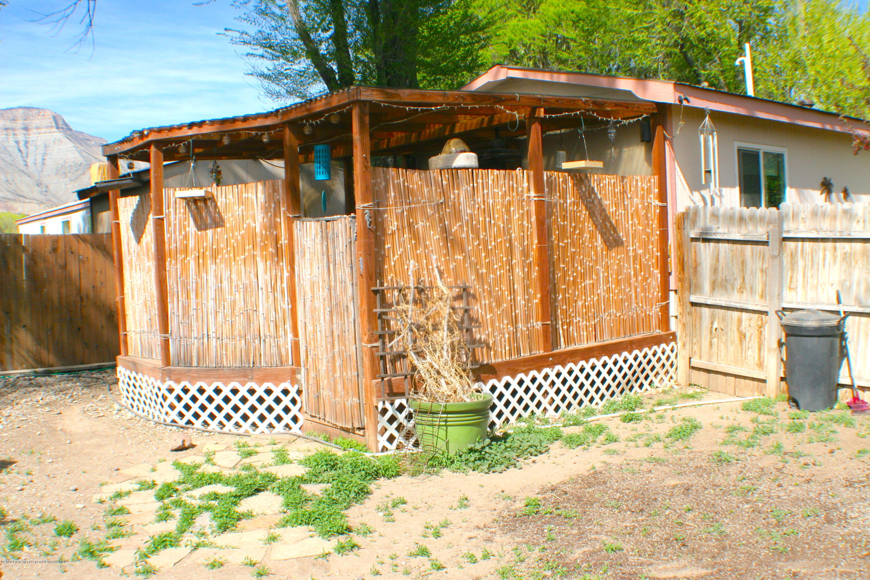 7 St John Circle Parachute, CO 81635 - Photo 16 of 18 a front view of a house with a yard