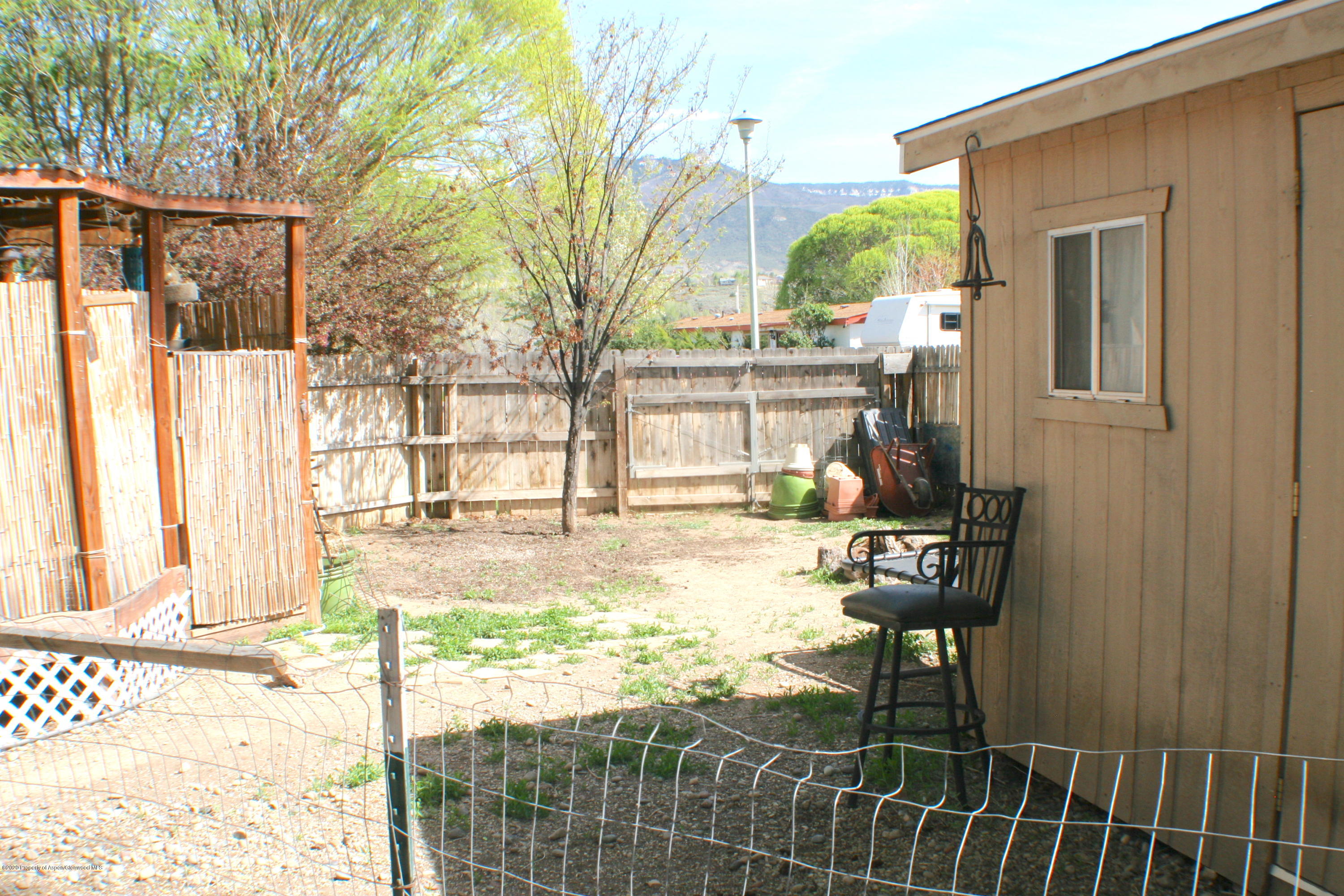 7 St John Circle Parachute, CO 81635 - Photo 17 of 18 a view of a house with backyard porch and sitting area