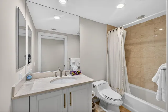 a living room with furniture large window and painting on the wall