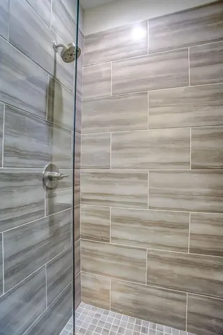 a bathroom with a double vanity sink and mirror