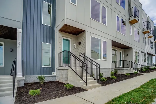 a view of a building with a yard