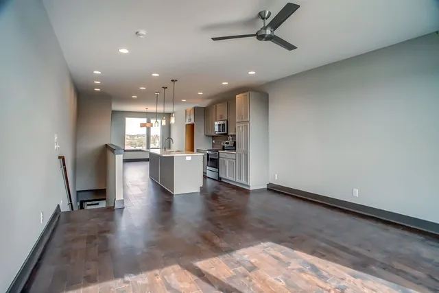 a view of kitchen with refrigerator and window