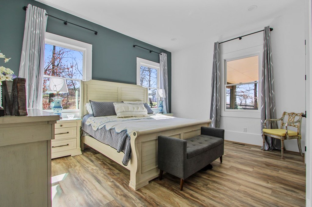 2086 Burnt Mountain Road Ellijay, GA 30536 - Photo 15 of 47 a bedroom with a bed and a couch