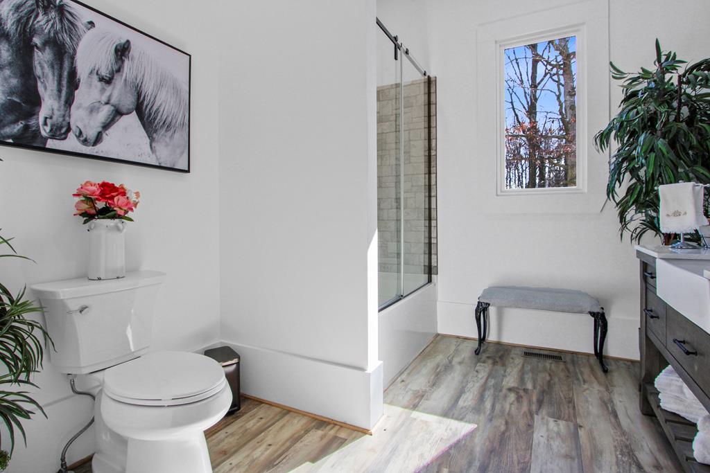 2086 Burnt Mountain Road Ellijay, GA 30536 - Photo 16 of 47 a bathroom with a toilet and a shower