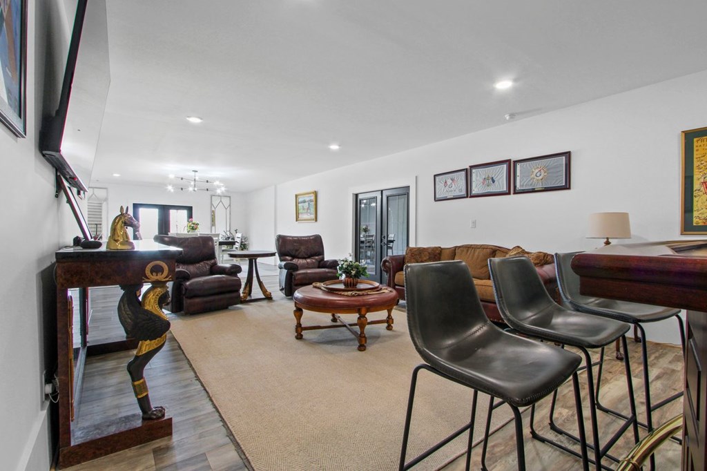 2086 Burnt Mountain Road Ellijay, GA 30536 - Photo 18 of 47 a living room with furniture and a flat screen tv