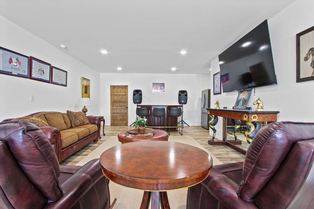 2086 Burnt Mountain Road Ellijay, GA 30536 - Photo 19 of 47 a living room with furniture and a flat screen tv